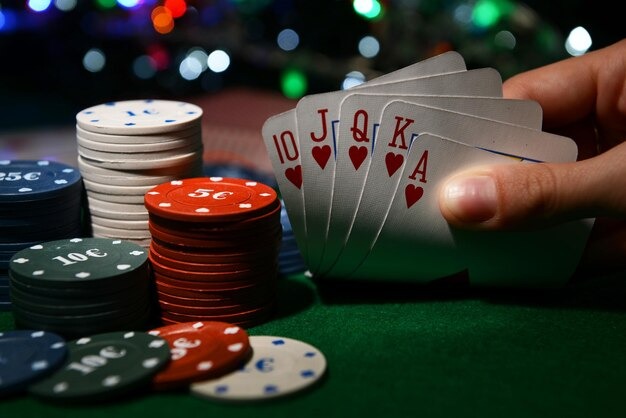 Live poker table on two-hundred-forty-two mobile app showing dealer and player cards